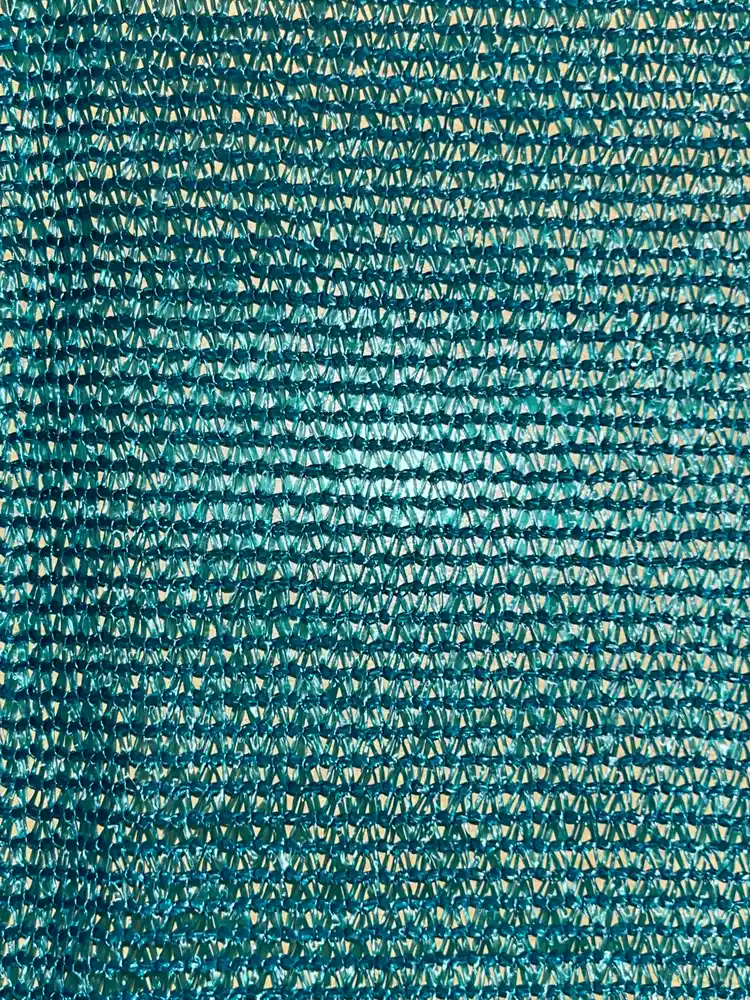 Tape shade net, evergreen with black border, 110 GSM, 75% shade, close-up