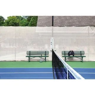 White shade net screen beside a tennis court